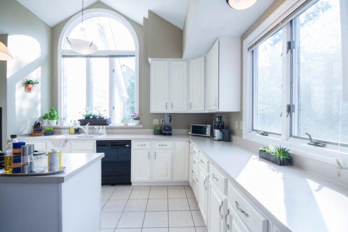 empty kitchen with white wooden cabinet